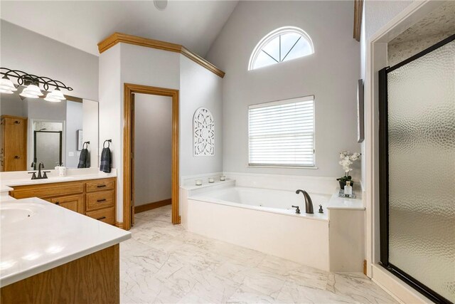 2 Conner Ln, Rogers, AR 72756 - bathroom with vanity, a stall shower, a garden tub, and marble look tiles