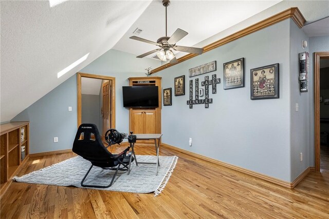 2 Conner Ln, Rogers, AR 72756 - sitting room with a ceiling fan, a skylight, vaulted ceiling, and wood finished floors