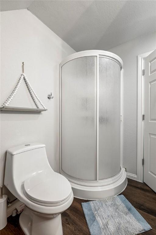 2 Conner Ln, Rogers, AR 72756 - bathroom with a shower stall and wood finished floors