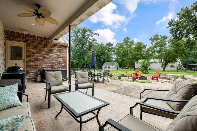 2 Conner Ln, Rogers, AR 72756 - view of patio / terrace with a fire pit, a shed, outdoor dining space, a ceiling fan, and a grill