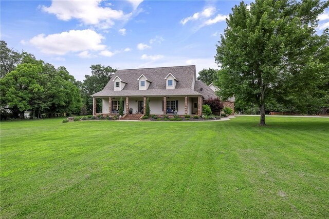 2 Conner Ln, Rogers, AR 72756 - cape cod home featuring covered porch and a front lawn
