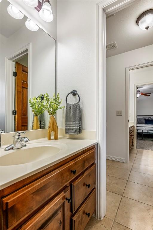 5100 SW Blaire Mont Rd, Bentonville, AR 72713 - bathroom featuring vanity, tile patterned flooring, and ceiling fan