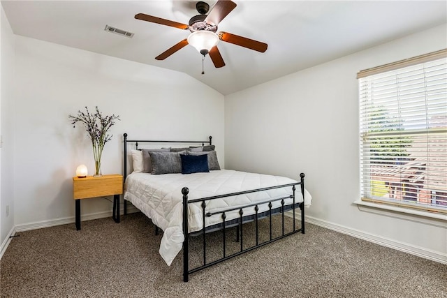 5100 SW Blaire Mont Rd, Bentonville, AR 72713 - carpeted bedroom with multiple windows, vaulted ceiling, and a ceiling fan