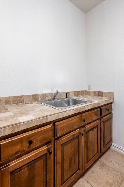 5100 SW Blaire Mont Rd, Bentonville, AR 72713 - bathroom featuring a sink and baseboards