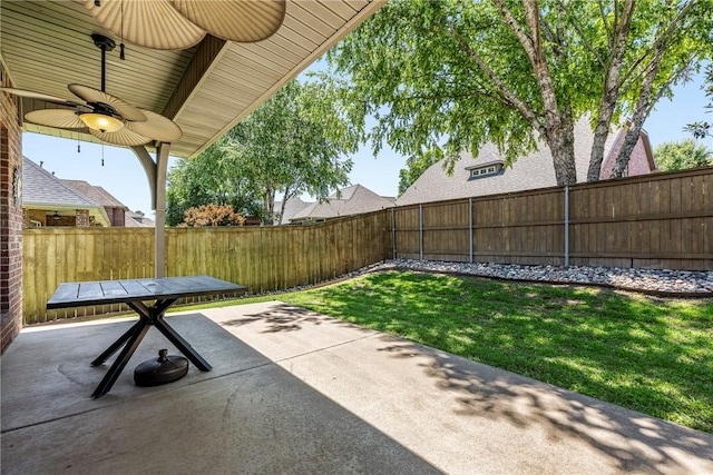 5100 SW Blaire Mont Rd, Bentonville, AR 72713 - fenced backyard with ceiling fan and a patio