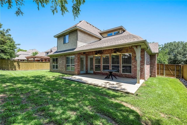 5100 SW Blaire Mont Rd, Bentonville, AR 72713 - rear view of property with brick siding, a fenced backyard, a patio, and roof with shingles