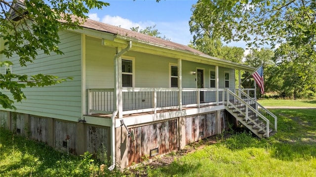234 N Kibler Hwy, Alma, AR 72921 - view of side of home featuring a porch and stairway