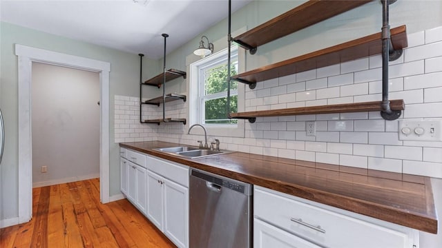 234 N Kibler Hwy, Alma, AR 72921 - kitchen with stainless steel dishwasher, open shelves, white cabinets, tasteful backsplash, and light wood-type flooring