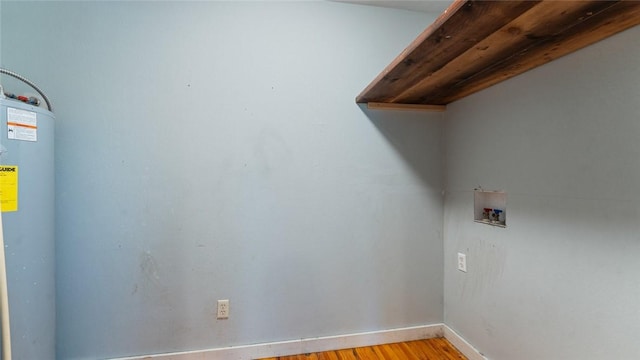 234 N Kibler Hwy, Alma, AR 72921 - laundry room featuring hookup for a washing machine, water heater, and light wood-style flooring