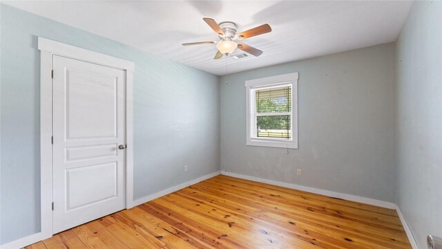 234 N Kibler Hwy, Alma, AR 72921 - empty room featuring light wood finished floors and ceiling fan