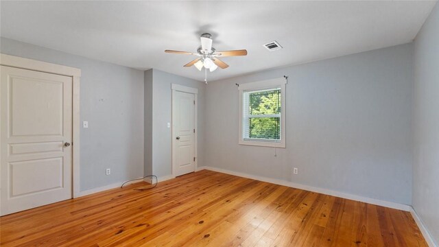 234 N Kibler Hwy, Alma, AR 72921 - unfurnished bedroom with light wood-type flooring and a ceiling fan