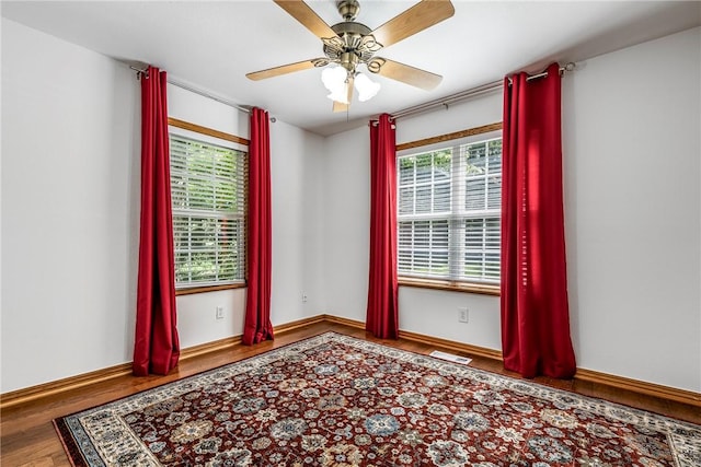 16101 Hickory Dr, Rogers, AR 72756 - empty room with wood finished floors and ceiling fan
