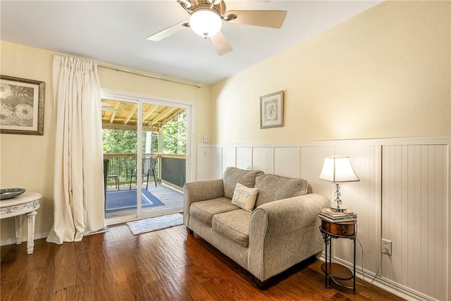 16101 Hickory Dr, Rogers, AR 72756 - living area featuring dark wood-type flooring, a ceiling fan, and wainscoting