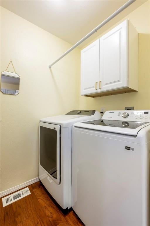 16101 Hickory Dr, Rogers, AR 72756 - laundry area with cabinet space, independent washer and dryer, and dark wood finished floors