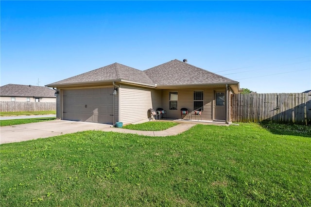 3900 SW Capstone Ave, Bentonville, AR 72712 - back of property featuring a garage, concrete driveway, and roof with shingles