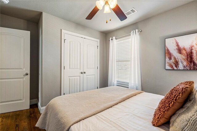 3900 SW Capstone Ave, Bentonville, AR 72712 - bedroom featuring dark wood finished floors, a closet, and ceiling fan