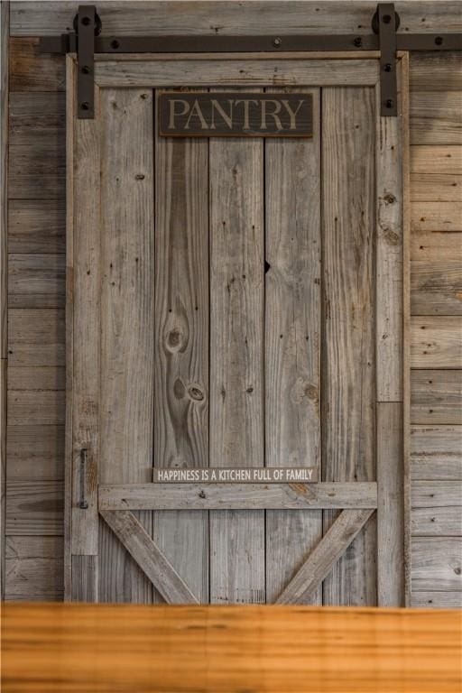 8252 Larue Rd, Rogers, AR 72756 - detailed view of a barn door and wooden walls