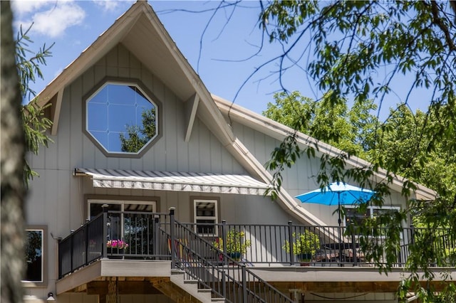 8252 Larue Rd, Rogers, AR 72756 - back of property featuring stairway, a standing seam roof, and a metal roof