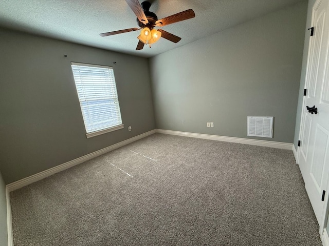 3115 SW Warberry Ave, Bentonville, AR 72713 - empty room featuring carpet, ceiling fan, and a textured ceiling