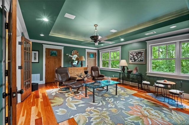 150 Jackson Cove Cres, Eureka Springs, AR 72631 - living area with a raised ceiling, wood finished floors, ceiling fan, crown molding, and recessed lighting