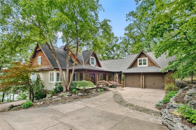 150 Jackson Cove Cres, Eureka Springs, AR 72631 - view of front facade with driveway, a garage, and a shingled roof