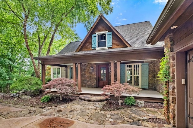 150 Jackson Cove Cres, Eureka Springs, AR 72631 - doorway to property with covered porch, stone siding, and roof with shingles