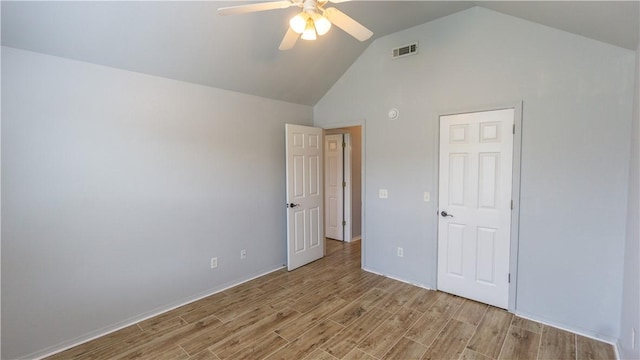 404 NE Whitney St, Bentonville, AR 72712 - unfurnished bedroom with vaulted ceiling, light wood-style floors, and a ceiling fan