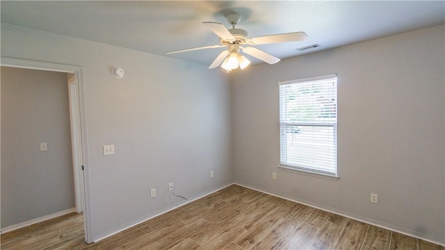404 NE Whitney St, Bentonville, AR 72712 - spare room with light wood-style floors and a ceiling fan