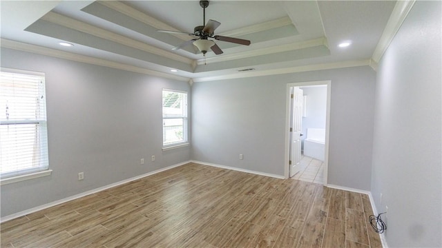 404 NE Whitney St, Bentonville, AR 72712 - spare room with ornamental molding, a tray ceiling, wood finished floors, a ceiling fan, and recessed lighting