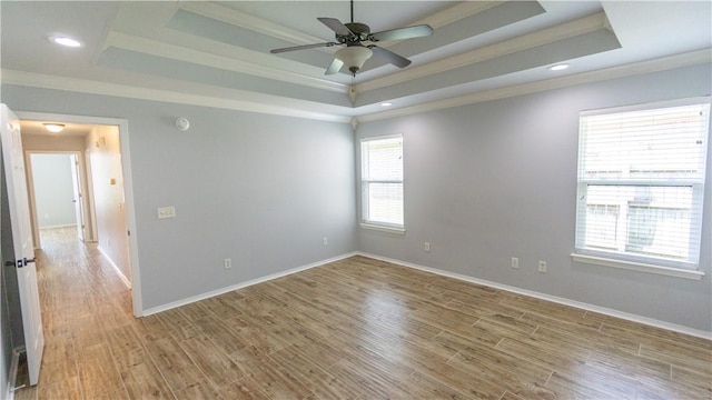 404 NE Whitney St, Bentonville, AR 72712 - spare room with a raised ceiling, ornamental molding, wood finished floors, ceiling fan, and recessed lighting