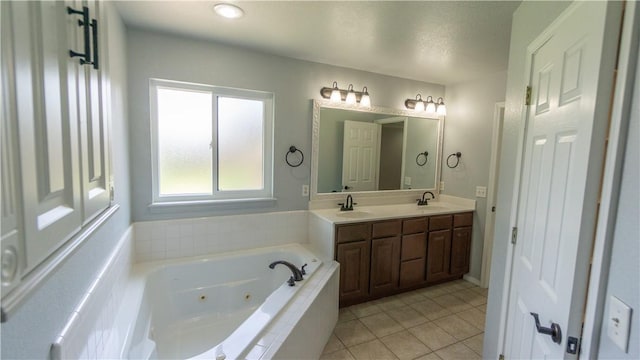 404 NE Whitney St, Bentonville, AR 72712 - bathroom with a tub with jets, double vanity, and tile patterned floors