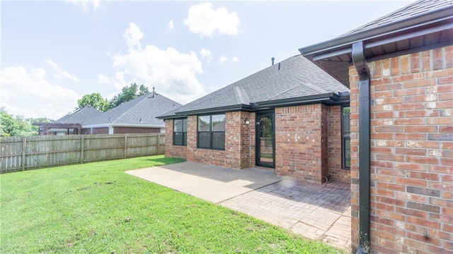 404 NE Whitney St, Bentonville, AR 72712 - fenced backyard featuring a patio