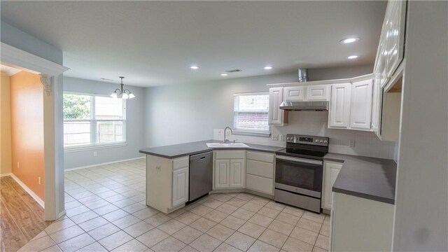 404 NE Whitney St, Bentonville, AR 72712 - kitchen with appliances with stainless steel finishes, healthy amount of natural light, a peninsula, a chandelier, and recessed lighting