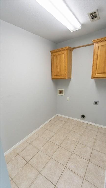 404 NE Whitney St, Bentonville, AR 72712 - laundry room featuring electric dryer hookup, cabinet space, and washer hookup