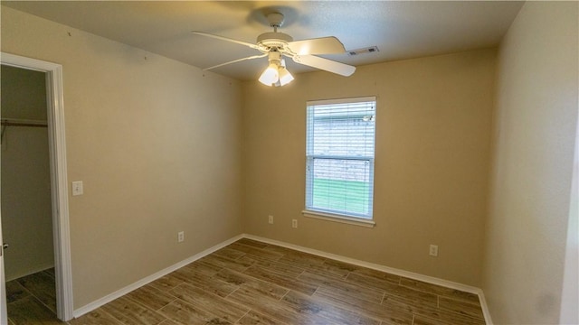 404 NE Whitney St, Bentonville, AR 72712 - unfurnished bedroom featuring wood finished floors, a closet, and a ceiling fan