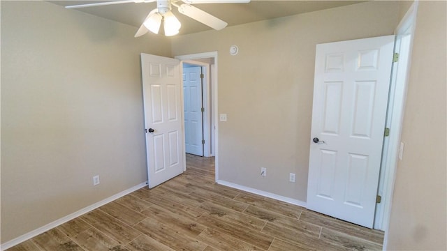 404 NE Whitney St, Bentonville, AR 72712 - unfurnished bedroom featuring wood finished floors and a ceiling fan
