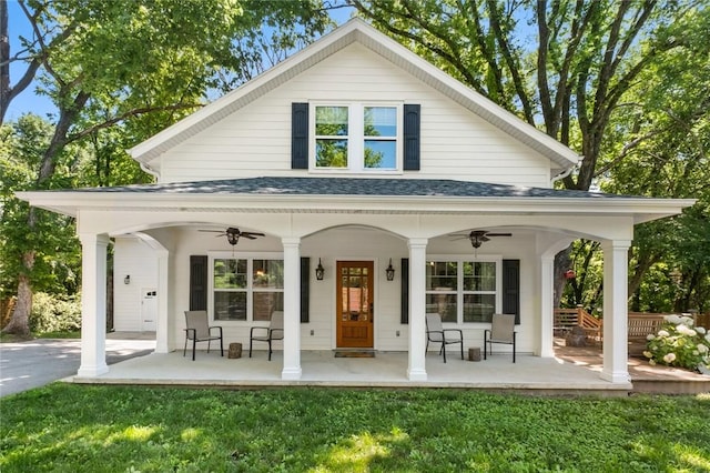 1330 S Curtis Ave, Pea Ridge, AR 72751 - back of house with a ceiling fan, a porch, and a yard