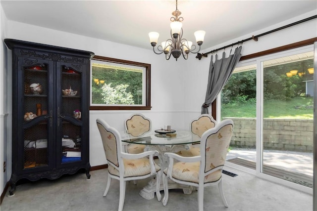 8173 Spanker Creek Rd, Bentonville, AR 72712 - dining area featuring a chandelier and finished concrete floors