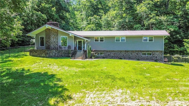 8173 Spanker Creek Rd, Bentonville, AR 72712 - split foyer home with a chimney and a metal roof