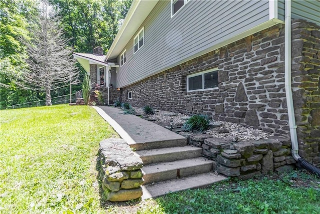 8173 Spanker Creek Rd, Bentonville, AR 72712 - view of home's exterior with stone siding and a chimney