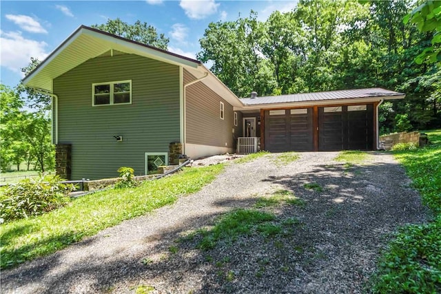 8173 Spanker Creek Rd, Bentonville, AR 72712 - view of side of property featuring driveway and an attached garage