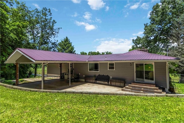 8173 Spanker Creek Rd, Bentonville, AR 72712 - rear view of property with entry steps, a patio, a lawn, and a metal roof