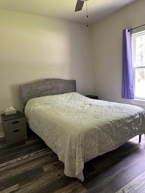 26 Osborne Dr, Bella Vista, AR 72715 - bedroom with dark wood finished floors and ceiling fan