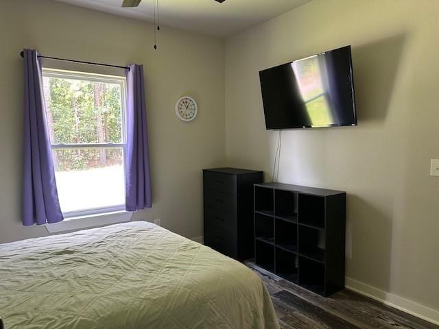 26 Osborne Dr, Bella Vista, AR 72715 - bedroom featuring dark wood finished floors and baseboards