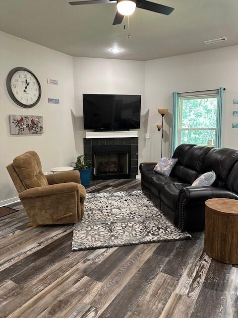 26 Osborne Dr, Bella Vista, AR 72715 - living area with a ceiling fan, wood finished floors, and a fireplace