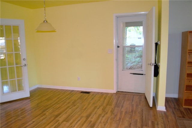 6 Hampstead Ln, Bella Vista, AR 72714 - unfurnished dining area with wood finished floors and baseboards
