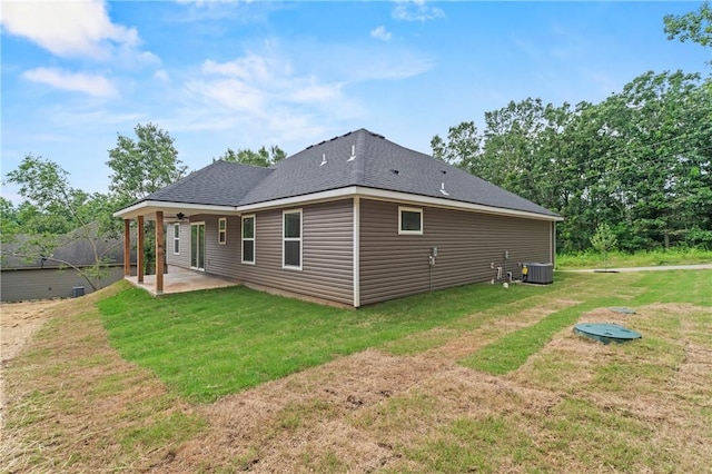 53 Belgravia Dr, Bella Vista, AR 72715 - rear view of house with a patio area, a yard, and roof with shingles
