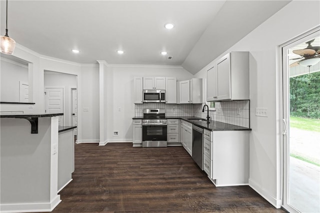 53 Belgravia Dr, Bella Vista, AR 72715 - kitchen featuring appliances with stainless steel finishes, backsplash, dark wood finished floors, recessed lighting, and pendant lighting