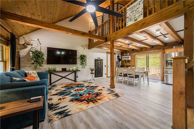 16175 N Cove Creek Wc 21 Rd, Prairie Grove, AR 72753 - living room featuring wooden walls, wood finished floors, a ceiling fan, and a wood ceiling with exposed beams