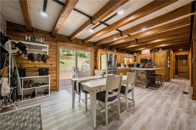 16175 N Cove Creek Wc 21 Rd, Prairie Grove, AR 72753 - dining area featuring wood walls, light wood-type flooring, and beam ceiling